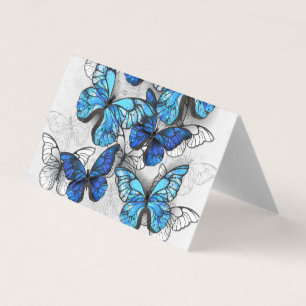 Compositie van witte en blauwe vlinders visitekaartje