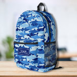 Cool Camo Shark Patroon Gepersonaliseerde Naam Tek Bedrukte Rugzak<br><div class="desc">Super leuke rugzak met een blauw camouflage haaienpatroon en uw aangepaste naam. Voeg een extra bonusregel tekst toe - telefoonnummer, teamnaam, gezegde, enz. - of verwijder deze. Ruimte genoeg voor boeken, computer, sportuitrusting en meer - of gebruik als reis- of logeertas ook. Koel en kleurrijk, maar toch zeer functioneel -...</div>