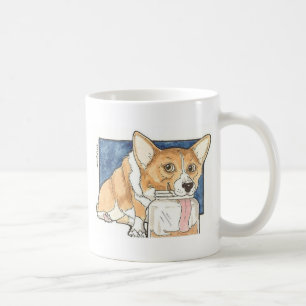 Corgi die op de pindakaas jar tikt koffiemok
