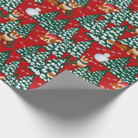 Corgis heeft plezier in het winterbos - rood cadeaupapier (Hoek)