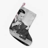 Couple sitting together in a restaurant flirting w kleine kerstsok (Voorkant (Hangend))