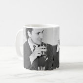 Coupled sitting together in a restaurant flirting  koffiemok (Voorkant links)