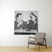 Coupled sitting together in a restaurant flirting  wandkleed (In situ)