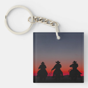 cowboy bij zonsondergang sleutelhanger