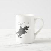 Cowboy die dinosaurus in het prehistorische tijdpe porselein kop (Rechts)