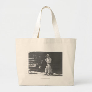 Cowboy die eet van een Peter Pan pindakaas kan. Grote Tote Bag