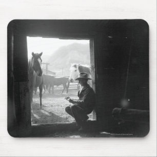 Cowboy in een deur met paarden muismat