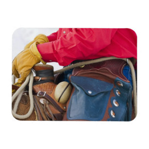 Cowboy op paard die leren chaps draagt magneet