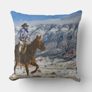 Cowboy op paard met leren chaps kussen