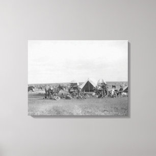 Cowboys die rond de foto van Chuckwagon zitten Canvas Afdruk