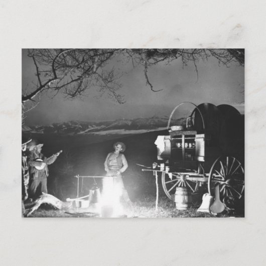 Cowboys spelen en zingen rond een kampvuur briefkaart (Voorkant)