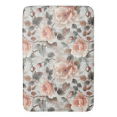 Crème bloemen met grijze bladeren op een lichtgrij badmat (Voorkant Verticaal)