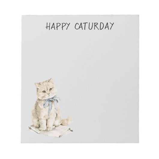 Crème Kat Blauwe Strik Caturday Notitieblok (Voorkant)