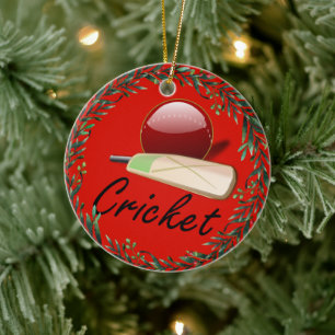 cricketknuppel en -bal, voorzien van een etiket, keramisch ornament
