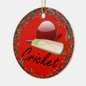 cricketknuppel en -bal, voorzien van een etiket, keramisch ornament (Links)