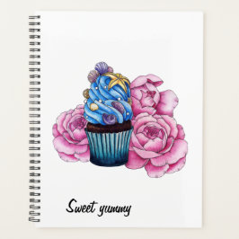 Cupcake met blauwe crème en roze pinda's planner