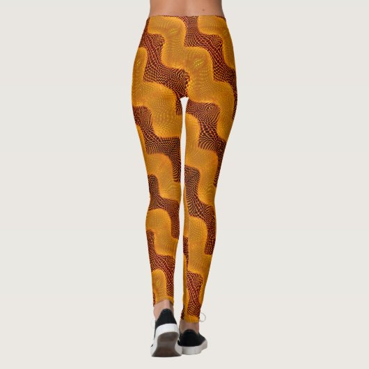 Curva laranja e pontos dourados sobre fundo marrom leggings (Achterkant)
