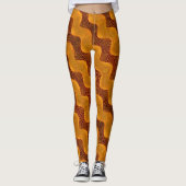 Curva laranja e pontos dourados sobre fundo marrom leggings (Voorkant)