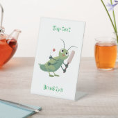Cut green cricket insect cartoon illustratie reclamebord met voetstuk (Insitu)