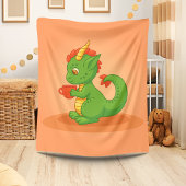 Cute Baby Dragon Holding Cup on Orange Fleece Deken