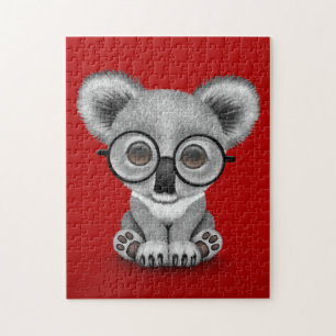 Cute Baby Koala Beer Cub Wearing Glasses on Red Legpuzzel