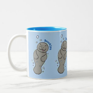 Cute baby manatee met bellenillustratie tweekleurige koffiemok