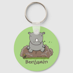 Cute baby rhino met groene cartoon illustratie sleutelhanger
