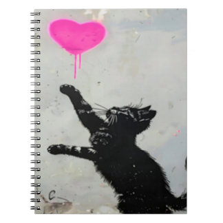Cute Black Cat Playing with A Pink Heart Notitieboek