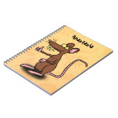 Cute brown rat duikt op cartoon notitieboek (Linkerzijde)