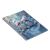 Cute budgies with bobble hats on a branch notitieboek (Rechterzijde)