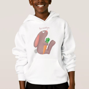 Cute bunny rabbit, zittend met wortelcartoon