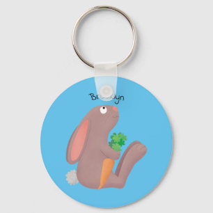 Cute bunny rabbit, zittend met wortelcartoon sleutelhanger