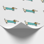 Cute dachshund in muntblauw cadeaupapier (Hoek)