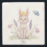 Cute Easter Cat with Chick Illustration Stenen Onderzetter<br><div class="desc">Add a charming seasonal accent to your table with this stone coaster featuring a whimsical Easter cat illustration. The playful design shows a curious cat wearing bunny ears, with a tiny chick perched on its head and a butterfly fluttering nearby among delicate spring flowers. The scene captures the joyful spirit...</div>