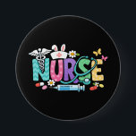 Cute Easter Nurse Medical Humor Ronde Button 7,6 Cm<br><div class="desc">Colorful lettering with a nurse hat,  stethoscope,  flowers and playful medical symbols. A cheerful graphic celebrating caring nurses and healthcare professionals during the Easter season with a bright and friendly hospital atmosphere.</div>