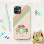 Cute Frog en paddenstoelen Cartoon | Naam iPhone 12 Hoesje<br><div class="desc">Deze leuke telefoonbehuizing is voorzien van een handgetekende kawaï-achtige cartoon kikker met een paddenstoeltje pet, samen met andere paddenstoelen, een slak, een bloem, een vlinder en gras. Een kleurenschema van rood, limoen, groen, bruin, oranje, geel en perzikkleurig is ideaal voor het esthetische liefhebber van de Kern van Indie of van...</div>