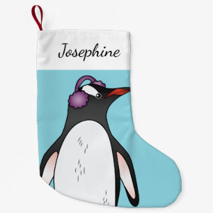 Cute Gentoo Penguin die de oorbescherming op blauw Kleine Kerstsok