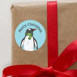 Cute Gentoo Penguin die een groen karf op blauw he Ronde Sticker