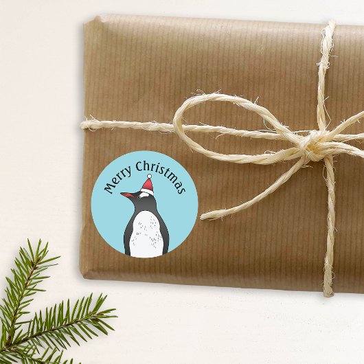 Cute Gentoo Penguin die een kersthat op blauw heef Ronde Sticker