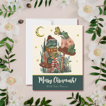 Cute Green Mushroom Kikker en Toad Merry Kerstmis Feestdagenkaart<br><div class="desc">Verspreid de vreugde en het lachen van dit vakantieseizoen met deze leuke en grappige paddenstoel met de kerstkaarten. Het ontwerp is voorzien van een met de hand geschilderde afbeelding van een kikker en een pad dat op rode paddenstoelen zit en geniet van een heerlijk kopje cacao. Creëer uw eigen one-of-a-kind...</div>