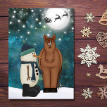 Cute Horse, Snowman, Santa en Reindeer Kerstmis Feestdagen Kaart<br><div class="desc">Cute Brown Horse en Snowman met de Kerstman en zijn rendier vliegen over een volle maan op een Snowy Kerstmis kerstavond Kaart. Inside Greeting - "Ik wens u een prettig kerstfeest en een gelukkig nieuwjaar! Moge al je vakantiedromen en wensen uitkomen." De groet kan worden gepersonaliseerd om te lezen zoals...</div>