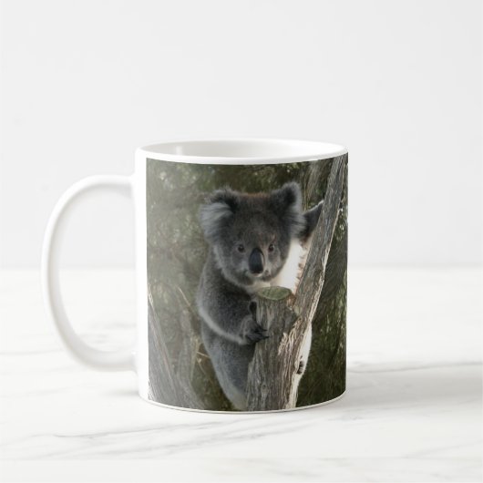 Cute Koala beklimt een Mok met een boomkoffie (Links)