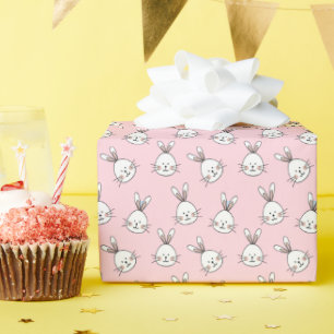 Cute konijnengezichtpatroon op lichtroze cadeaupapier