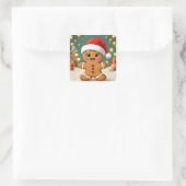 Cute little gingerbread man with Christmas hat Vierkante Sticker (Tas)