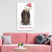 Cute Otter die met Kerstmis een kerstman heeft. Canvas Afdruk (Insitu (Woonkamer))