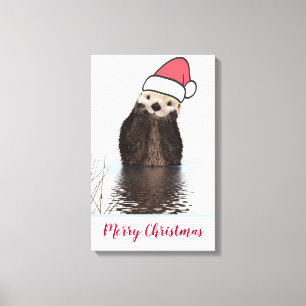 Cute Otter die met Kerstmis een kerstman heeft. Canvas Afdruk