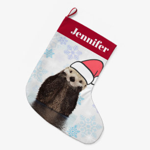 Cute Otter die met Kerstmis een kerstman heeft. Grote Kerstsok