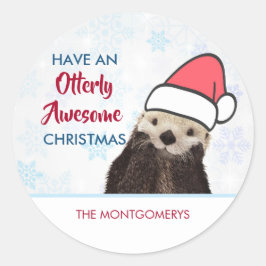 Cute Otter die met Kerstmis een kerstman heeft. Ronde Sticker