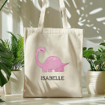 Cute Pink Dinosaur Persoonlijk Tote Bag<br><div class="desc">De canvas tas van deze meisjes toont een schattige illustratie van een roze dinosaurus met lange wimpers. Pas het aan met de naam van uw kind in zwarte letters. Maakt een geweldige boekzak!</div>