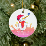 Cute Snowman Baby's eerste Kerstmis Keramisch Ornament<br><div class="desc">Cute Snowman Baby's eerste kerstkeramische versiering. Snowman met een sneeuwvlok op zijn neus koelen. De achtergrond is een kleurrijke regenboogkleurspatbol met witte sneeuwvlokken. Eenvoudig te personaliseren met jouw naam en geboortejaar.</div>
